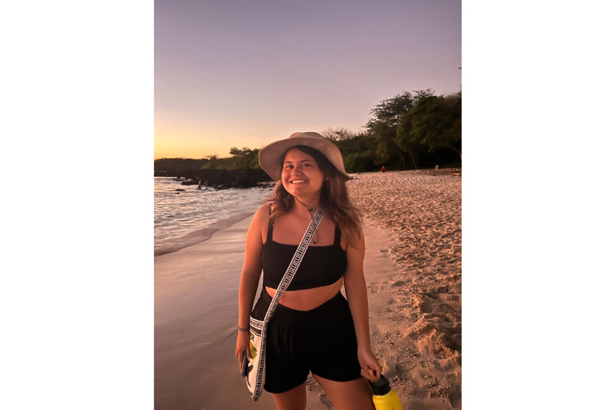 Arianna on a beach at sunset